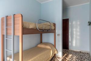 Postel nebo postele na pokoji v ubytování B&B La Mortella