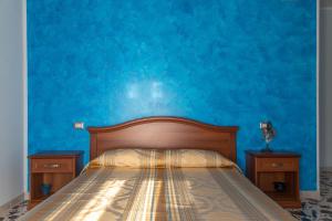 Postel nebo postele na pokoji v ubytování B&B La Mortella