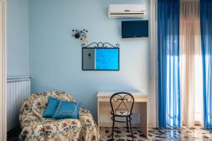 Postel nebo postele na pokoji v ubytování B&B La Mortella