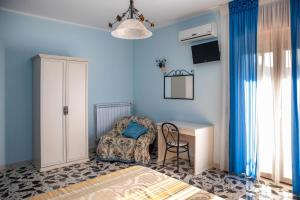 Postel nebo postele na pokoji v ubytování B&B La Mortella