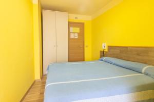 Un pat sau paturi într-o cameră la Albergo Speranza