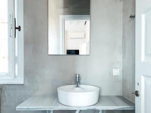 Um banheiro em Fabrica Sunset Apartments