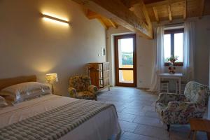 Postel nebo postele na pokoji v ubytování Agriturismo Cheloni