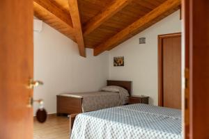 Postel nebo postele na pokoji v ubytování B&B La Mortella + 37 fotografií