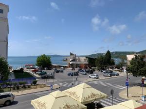 a street with cars parked in a parking lot at Sea Square Hotel in Balchik