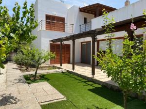 a view of a house with a yard at Demelida Villa in Tsada, Paphos in Tsadha