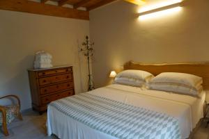 Postel nebo postele na pokoji v ubytování Agriturismo Cheloni