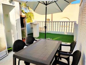 A patio or other outdoor area at Townhouse with bbq and pools - Costa Hispania