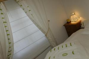Postel nebo postele na pokoji v ubytování Auberge Saint Laurent