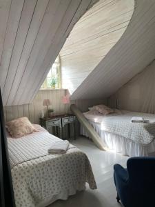 Postel nebo postele na pokoji v ubytování Arphus Lodge + 18 fotografií