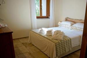 Postel nebo postele na pokoji v ubytování Agriturismo Cheloni