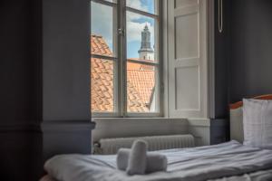 Postel nebo postele na pokoji v ubytování Stora Torget - Visby Lägenhetshotell