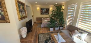 a living room with a table and a couch at Šarlotos apartamentai in Klaipėda