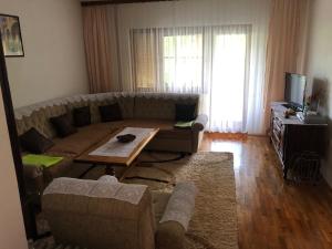 a living room with a couch and a table at House Greda in Bihać