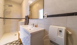 a white bathroom with a sink and a mirror at Lyves Two in Liège +45 photos