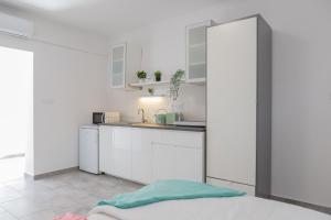 Kuchyň nebo kuchyňský kout v ubytování Jázmin Apartman