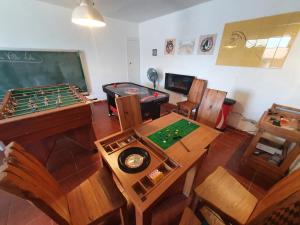 a classroom with a table and a chalkboard and a table at Villa Lola - Casa con Futbolín-Billar-Diana - 6pax - VV-1734-AS in Gijón