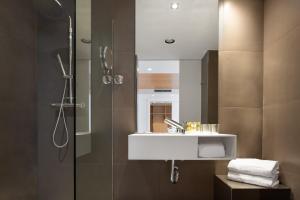 a bathroom with a sink and a shower at Eurostars Marqués de Vallejo in Logroño