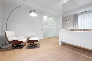 a white office with two chairs and a desk at Eurostars Marqués de Vallejo in Logroño