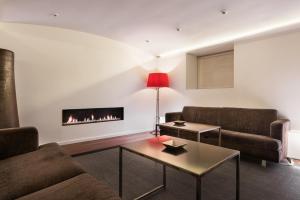 a living room with two couches and a fireplace at Eurostars Marqués de Vallejo in Logroño