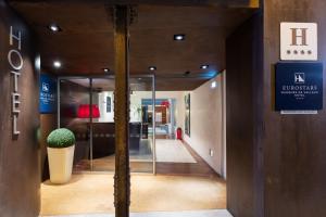 a hallway in a building with glass doors at Eurostars Marqués de Vallejo in Logroño