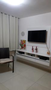 A television and/or entertainment centre at Sol e Mar Solar do Atlântico