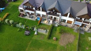 an aerial view of a large house with a yard at Apartmány Kubova Huť in Kubova Huť