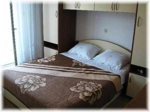 Postel nebo postele na pokoji v ubytování Apartment 696-7 for 4+2 pers. in Lopar