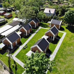 an overhead view of a row of houses with solar panels at Costa de Wyspa in Gdańsk