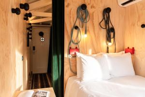 Llit o llits en una habitació de SWEETS - Omvalbrug
