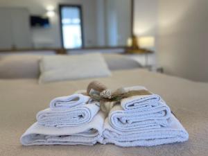 Ένα ή περισσότερα κρεβάτια σε δωμάτιο στο Dimora Bellini Apartment and Rooms +29 φωτογραφίες