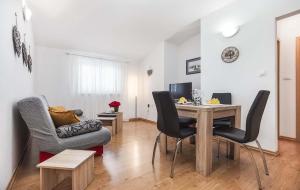 a living room with a table and chairs at Branka in Poreč