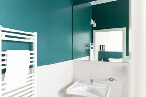 a bathroom with a sink and a mirror at Villa delle Palme in Santa Marinella +37 photos