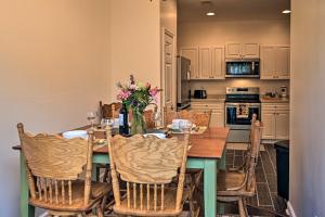 a kitchen with a dining room table with chairs at Myrtle Beach Townhouse in Legends Golf and Resort! in Myrtle Beach