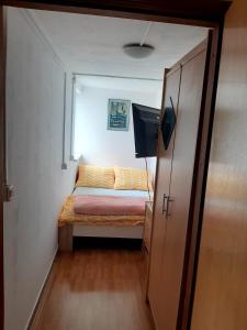 Postel nebo postele na pokoji v ubytování Apartment TIM + 5 fotografií