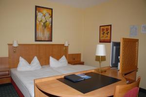 Postel nebo postele na pokoji v ubytování Hotel Alte Schule