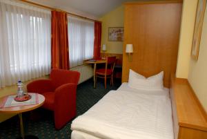 Postel nebo postele na pokoji v ubytování Hotel Alte Schule