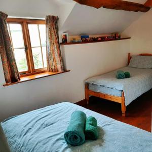 Katil atau katil-katil dalam bilik di Eco Cottage Joe the Buck