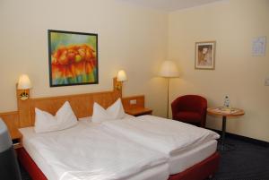 Postel nebo postele na pokoji v ubytování Hotel Alte Schule
