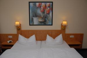 Postel nebo postele na pokoji v ubytování Hotel Alte Schule