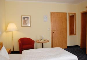 Postel nebo postele na pokoji v ubytování Hotel Alte Schule