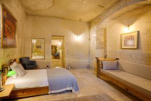 Postel nebo postele na pokoji v ubytování Design Cave Hotel