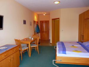 Postel nebo postele na pokoji v ubytování Gästeappartements Sonnenland + 37 fotografií