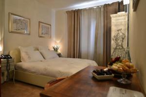 A bed or beds in a room at Mulino dell'Abbazia Country Resort