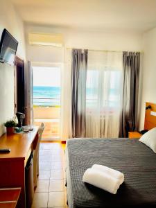 Ένα ή περισσότερα κρεβάτια σε δωμάτιο στο Hotel Patricia