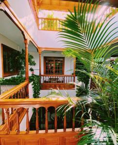 a wooden staircase in a house with plants at Apartamentos Tapahuga in Playa de Santiago