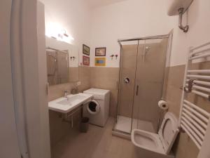 a bathroom with a sink toilet and a shower at House In The Light VATICAN Appartamento per vacanze in Rome +14 photos