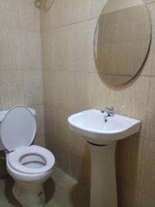 A bathroom at Room in Lodge - Lois Hotels Ltd Makurdi