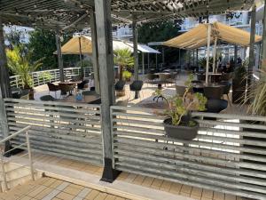 a restaurant with tables and chairs and umbrellas at Day Dream in Burgas City