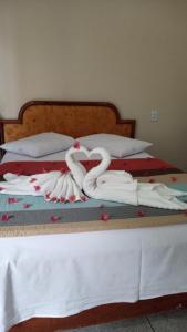 Ein Bett oder Betten in einem Zimmer der Unterkunft Pousada 4 Estações